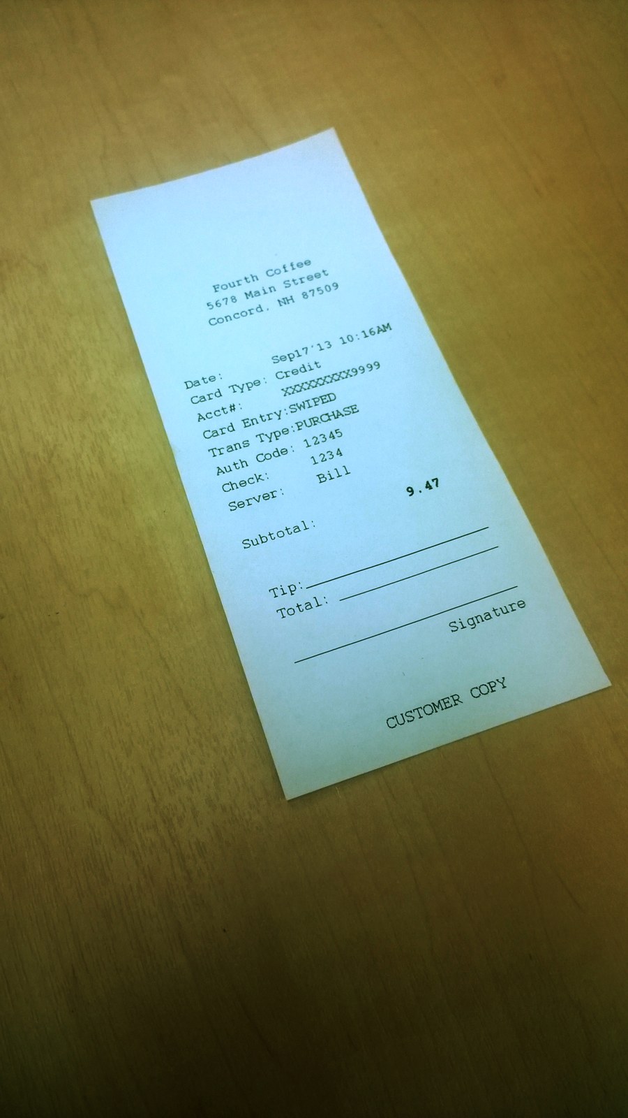 A receipt shot at an angle on a desk